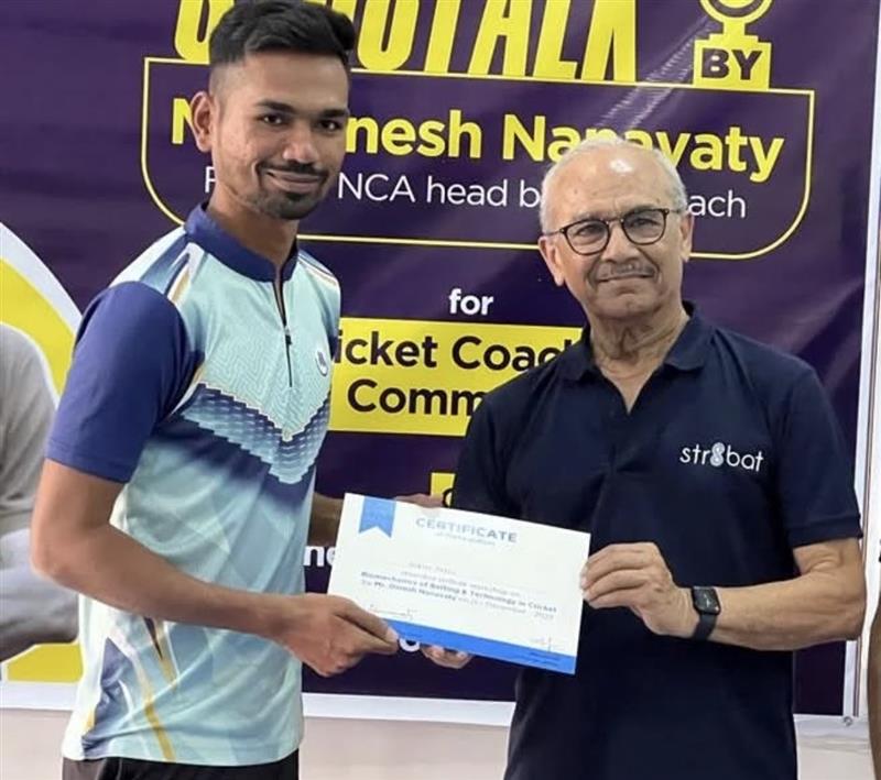 Head Coach Robin Patel mentoring players